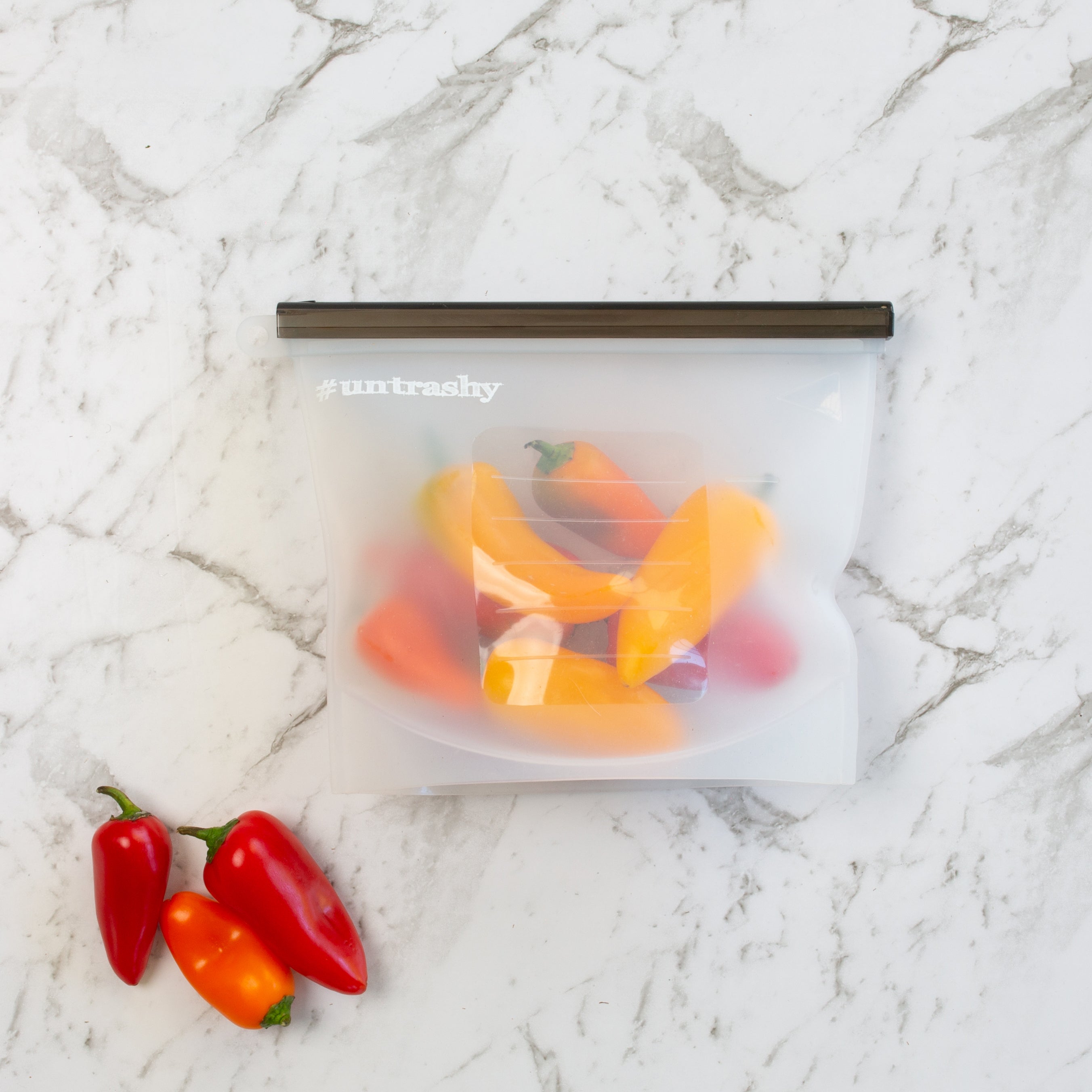 Silicone food pouch containing red and yellow chillis