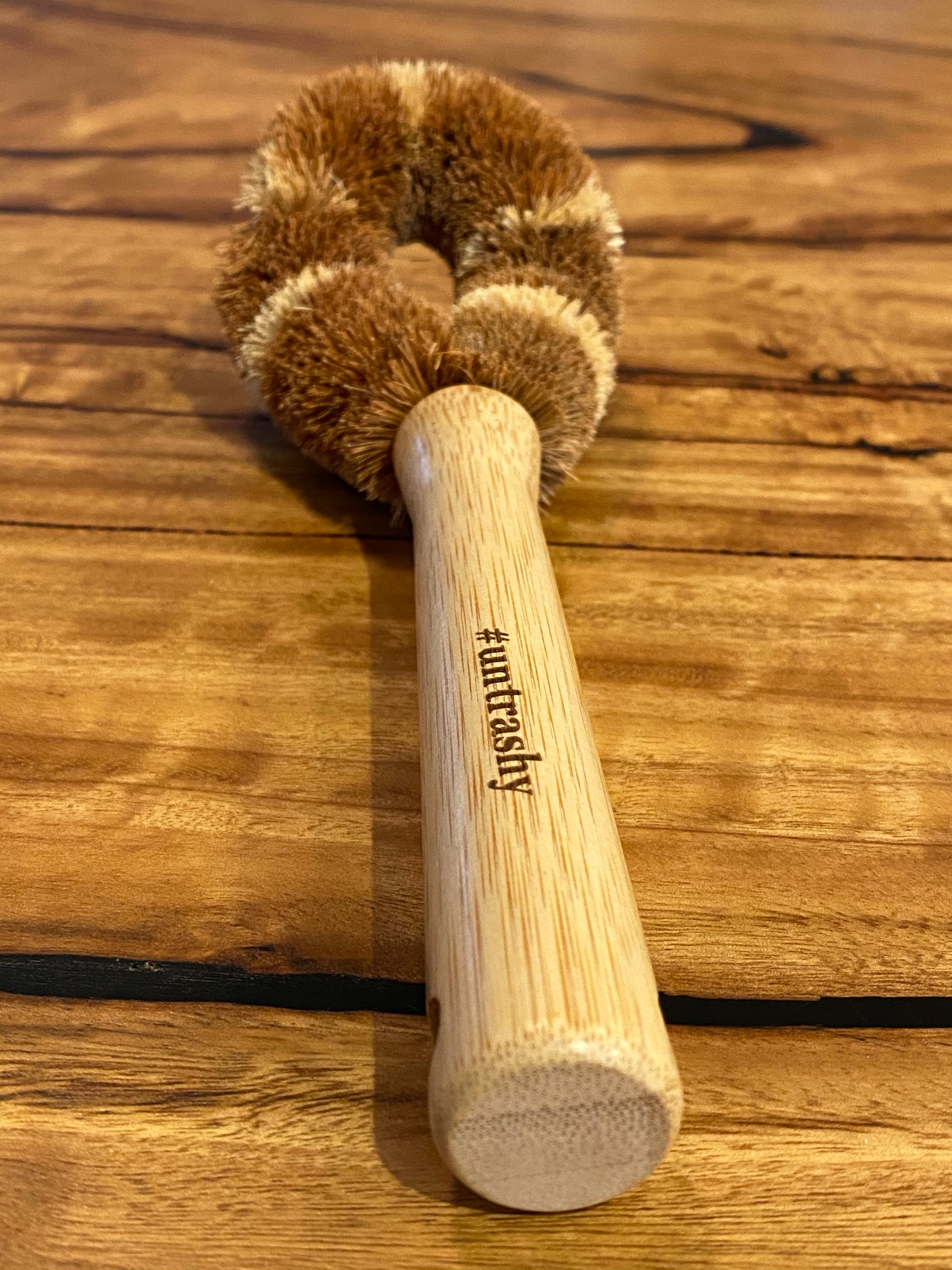 #untrashy branded dish brush on wooden table